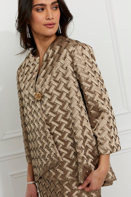 Woman wearing a patterned dress against a white background