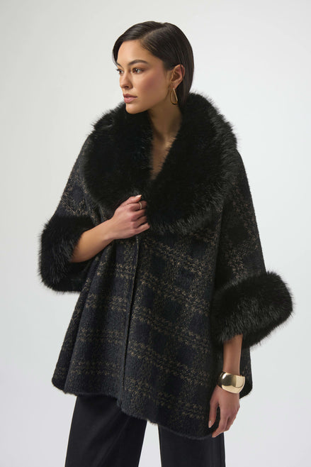 Woman wearing a dark coat with fur trim on a white background