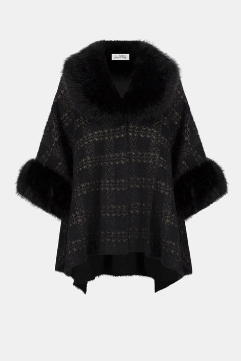 Black poncho with fur trim on a white background