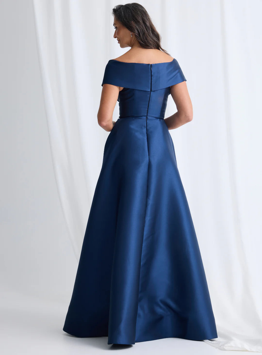 Navy blue off-shoulder gown on a white background