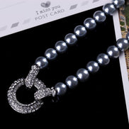Faux Pearl Necklace with Statement Diamante Love Ring 9