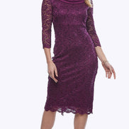 A woman in a purple stretch sequin lace dress with a chiffon shawl cascading down the back, featuring a cowl neckline and three-quarter sleeves.