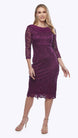 A woman in a purple stretch sequin lace dress with a chiffon shawl cascading down the back, featuring a cowl neckline and three-quarter sleeves.