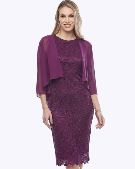 A mid-length purple stretch sequin dress with a scallop hemline, paired with a chiffon bolero jacket.