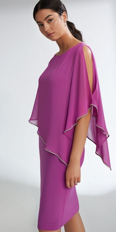 Woman wearing a purple dress with a draped design on a white background