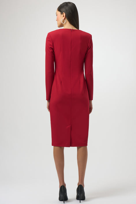 Red dress worn by a model on a white background