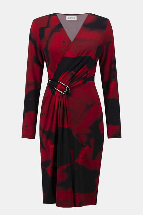 Red and black patterned dress with a belt on a white background