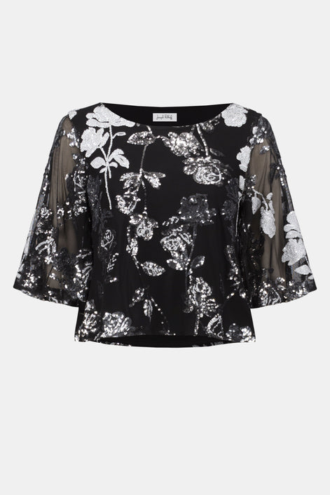 Black floral blouse with sheer sleeves on a white background
