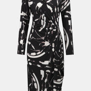 Black and white abstract patterned dress on a white background