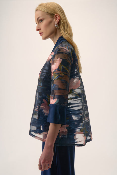 Woman wearing a floral kimono against a white background