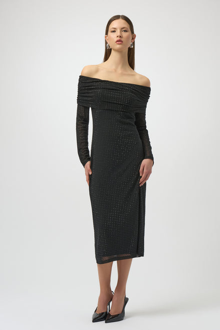 Woman wearing a black off-shoulder dress on a white background