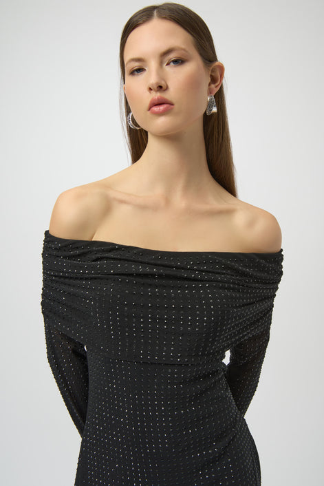 Woman wearing a black off-shoulder dress with a white background