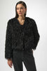 Woman wearing a black textured jacket against a white background