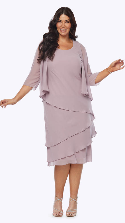A woman wearing a chiffon layered dress with a long-sleeved jacket in a light purple color.