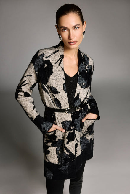 Woman wearing a patterned coat with a gray background